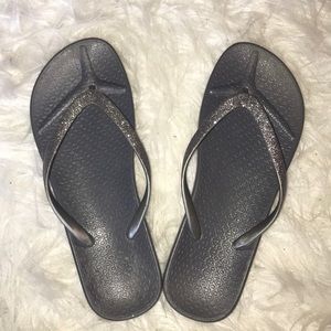 Grey sparkle flip flops